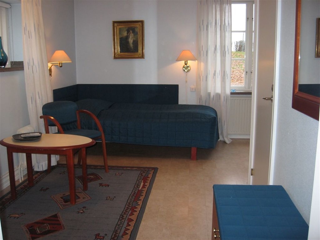 Vardagsrum med extrasäng på Hussborg Herrgård.