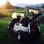 Golfbil på golfbanan vid Hussborg Golfklubb.